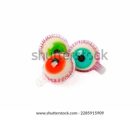 Halloween gummy eye candy isolated on white background.Classic candy sweets for Halloween with.Halloween holiday concept with candy corn and Jack-o-lantern.