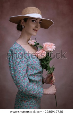 Romantic woman in hat with bouquet of flowers.Art processing.