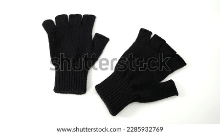 A pair of hand gloves to protect from cold and dirt, equipment used for high-resolution photography against a white background