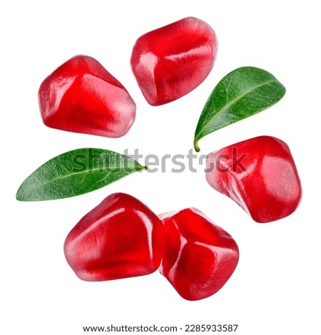 Pomegranate seeds isolated. Pomegranate grains with leaves flat lay on white background. Pomegranate macro with clipping path. Top view. Full depth of field. Royalty-Free Stock Photo #2285933587