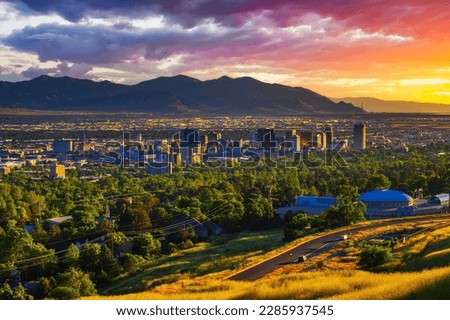 Salt Lake City skyline at sunset with Wasatch Mountains in the background, Utah, USA. Royalty-Free Stock Photo #2285937545