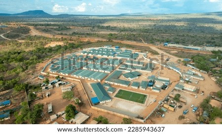 aerial shot of the Rufiji River landscape with worker housing in the Selous Game Reserve, Tanzania