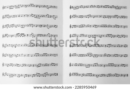 Sheet music book as background, top view