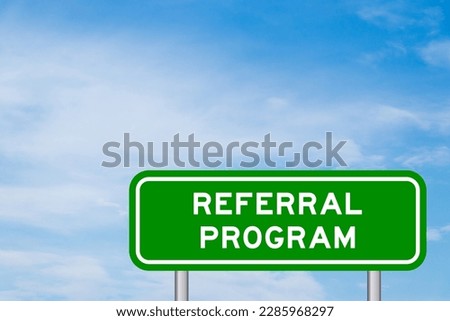 Green color transportation sign with word referral program on blue sky with white cloud background