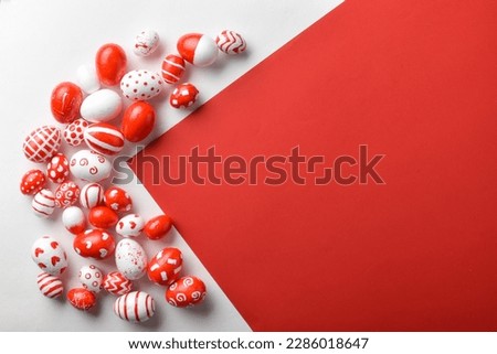Easter backgrounds, geometric Easter red and white eggs on a white-red background. Copy space. Flat lay, top view. Royalty-Free Stock Photo #2286018647