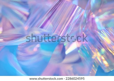 Close-up of ethereal pastel neon blue, purple, pink, mint holographic metallic foil background. Abstract modern curved soft focused, blurred, surreal futuristic disco, rave, dreamlike backdrop