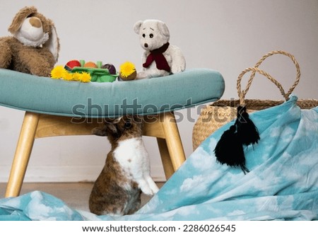 cute easter bunnies with eggs and flowers