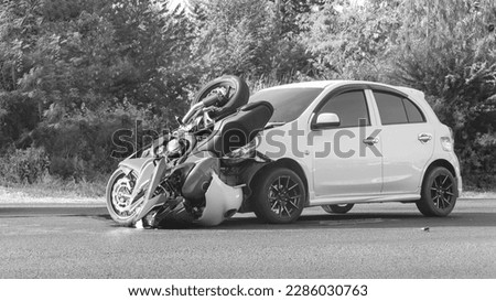 Motorcycle accident with a car. white-black picture