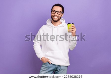 Photo of young program developer man latin wear new specs hold his fresh mcdonalds latte look mockup isolated on purple color background