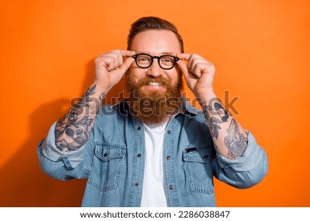 Photo of positive manager guy wearing specs looking in camera try new glasses isolated on shine color background Royalty-Free Stock Photo #2286038847