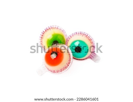 Halloween gummy eye candy isolated on white background.Classic candy sweets for Halloween with.Halloween holiday concept with candy corn and Jack-o-lantern.