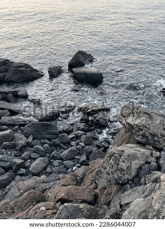 After I went on a trip, I took a picture of the sea and rocks because they looked great.  She likes taking pictures of landscapes.