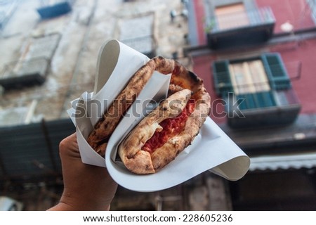 Famous street food in Naples - pizza margherita Royalty-Free Stock Photo #228605236