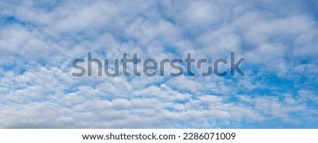Blue sky with white cirrus clouds, panorama