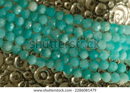 Small faceted beads of natural amazonite.