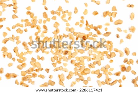 Pile chopped and roasted hazelnut isolated on white, top view Royalty-Free Stock Photo #2286117421