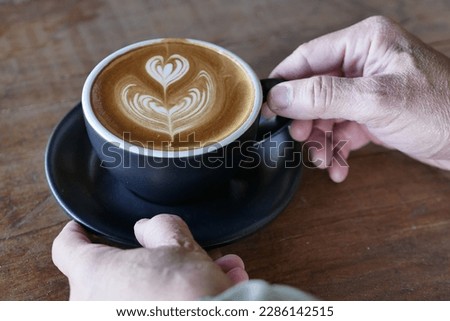 
Man holding coffee cup, business and drink concept