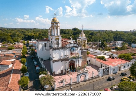 aerial view of beautiful church in the magical town of Comala in Colima, Mexico, white town, wide angle photo.