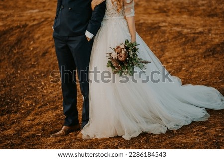 Bride and groom photo session in a desert like landscape. Elopement. Film like photography.