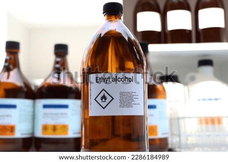 Ethyl alcohol in glass,Hazardous chemicals and symbols on containers in industry or laboratory 