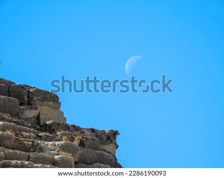 The moon above the Pyramid of cheops in detail. The Great Pyramid of Giza is the largest Egyptian pyramid and the tomb of Fourth Dynasty pharaoh Khufu. Royalty-Free Stock Photo #2286190093