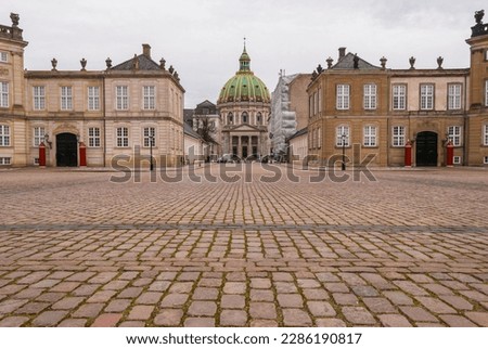 The view of Frederick’s Church and Amalienborg Palace, the residence of the Danish royal family, in the center of Copenhagen, Denmark
