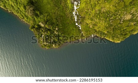 High waterfall over a Patagonia lake