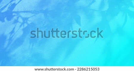 Fresh green, young leaves, shadows, watermark blue background