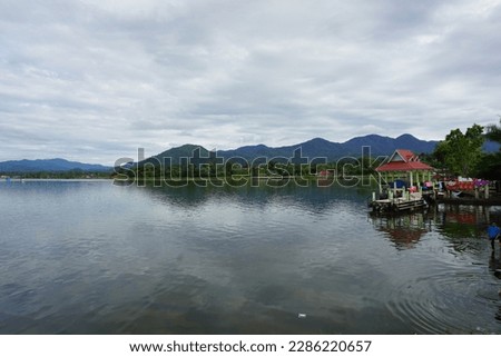 A silence on the shores of Lake Kerinci with a beautiful view of the highland hills (Jambi, Indonesia) Royalty-Free Stock Photo #2286220657