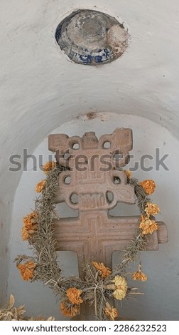 old cross with Easter decorations