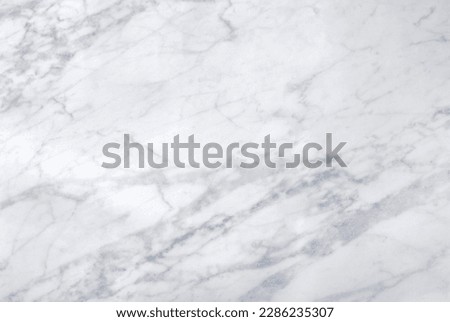 Photography of a light marble surface for food photography or similar. Top down view.