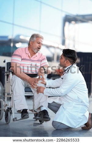 Doctor checking to old man while he is moaning in pain. Royalty-Free Stock Photo #2286265533