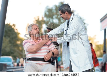 Doctor checking to old man while he is moaning in pain. Royalty-Free Stock Photo #2286265553
