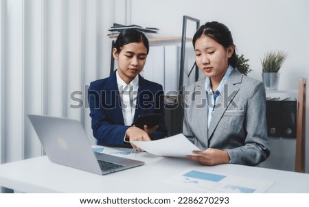 Young Asia female leader business woman coaching new smes bookkeeping audit accounting interview with trainer training business job.