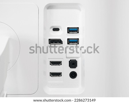 Rear of modern 4K computer monitor showing USB-C, DisplayPort and HDMI ports. Royalty-Free Stock Photo #2286273149