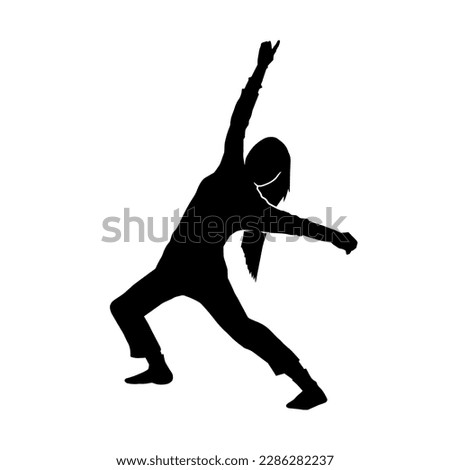 Silhouette of a female dancer in action pose. Silhouette of a woman dancing in casual costume.
