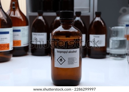 Isopropyl alcohol in glass,Hazardous chemicals and symbols on containers in industry or laboratory 