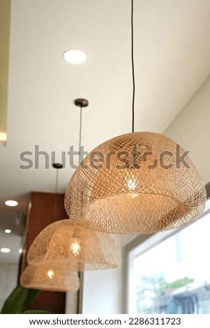 Wicker Pendant Lamp, rattan ceiling pendant lamp hangs on ceiling, home lighting and decoration.