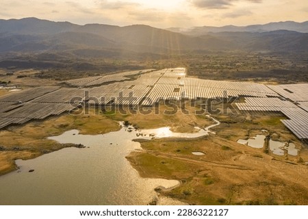 Aerial view of Solar panel, photovoltaic, alternative electricity source - concept of sustainable resources on a sunny day, Song Bieu lake, Ninh Thuan, Vietnam