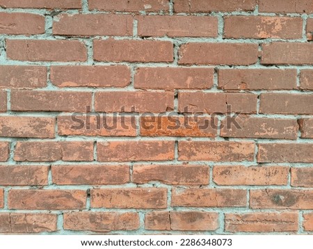 Old brick wall background, brick wall texture, structure. old broken brick, cement joints, close-up. crumbling from old age. construction, repair. concept of devastation, decline. High quality photo
