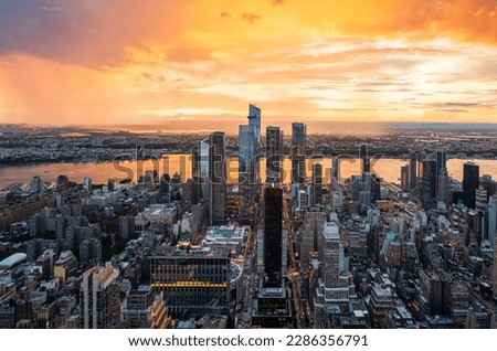 A beautiful colourful sunset during rainy storm over the Hudson Yards in New York City. Royalty-Free Stock Photo #2286356791