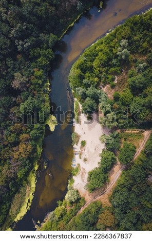 Drone aerial of serene forest river