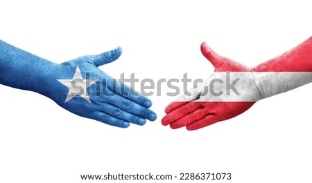 Handshake between Austria and Somalia flags painted on hands, isolated transparent image.