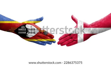 Handshake between Denmark and Eswatini flags painted on hands, isolated transparent image.
