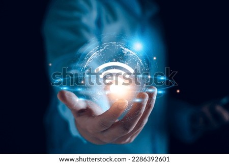 Wifi internet access concept. man using smartphone connect communication, social network, business contact, online shopping via internet wifi hotspot high speed. Fast internet wifi hotspot sharing.  Royalty-Free Stock Photo #2286392601