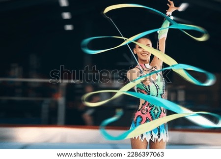 Ribbon dancing, portrait and happy woman in gymnastics competition, talent show and dark mockup arena. Female dancer, rhythmic movement and smile for action, creative performance and sports concert