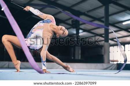 Ribbon, gymnastics and flexible woman stretching in performance, dance training and sports competition. Female, rhythmic movement and dancing athlete for creative skill, talent and concert in arena