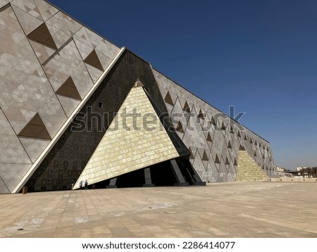 Pictures of the brand new Grand Egyptian Museum from outside with its Pyramids like shape Royalty-Free Stock Photo #2286414077