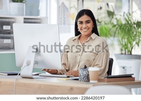 Portrait, happy or Indian woman at a desk typing an email, planning schedule or company goals. Administration, smile or computer of proud Human Resources manager, corporate person or worker in office Royalty-Free Stock Photo #2286420197