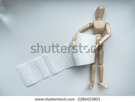 Wooden puppet with toilet paper roll
